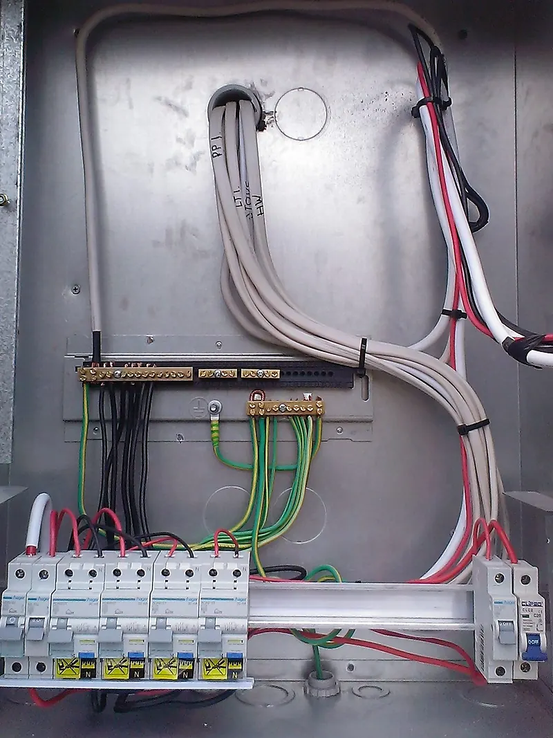 Board in a steel enclosure with cables routed in neat runs