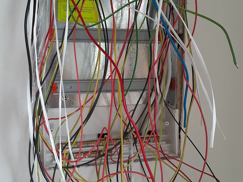 Switchboard opened up mid rewire with old cables pulled out and ready for the new board
